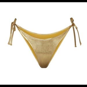 Skims metallic swim dipped tie bottoms. Gold